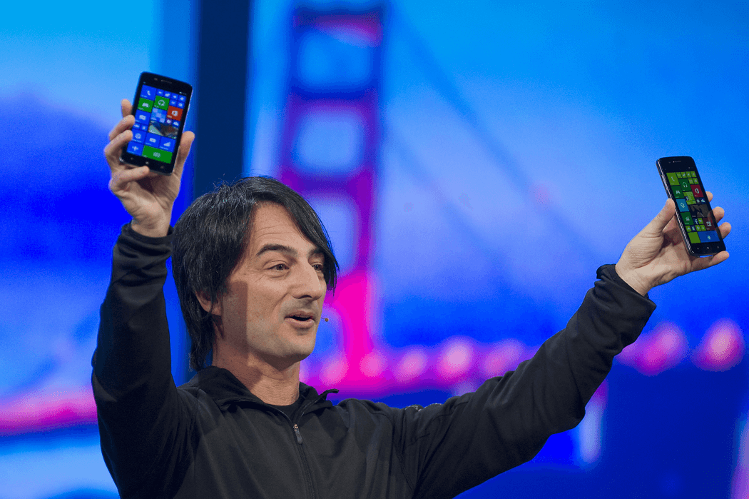 An image of a Microsoft employee presenting Windows phone.
